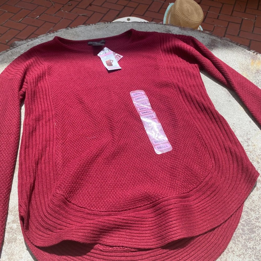 Red sweater design history